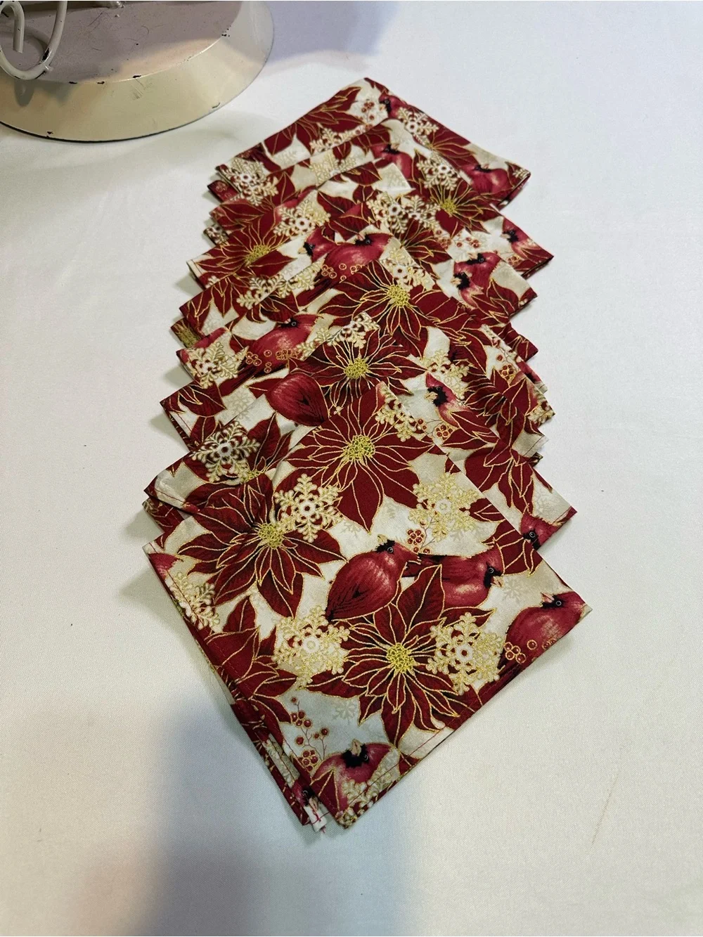 Poinsettia and cardinal apron, napkin, and table runner set